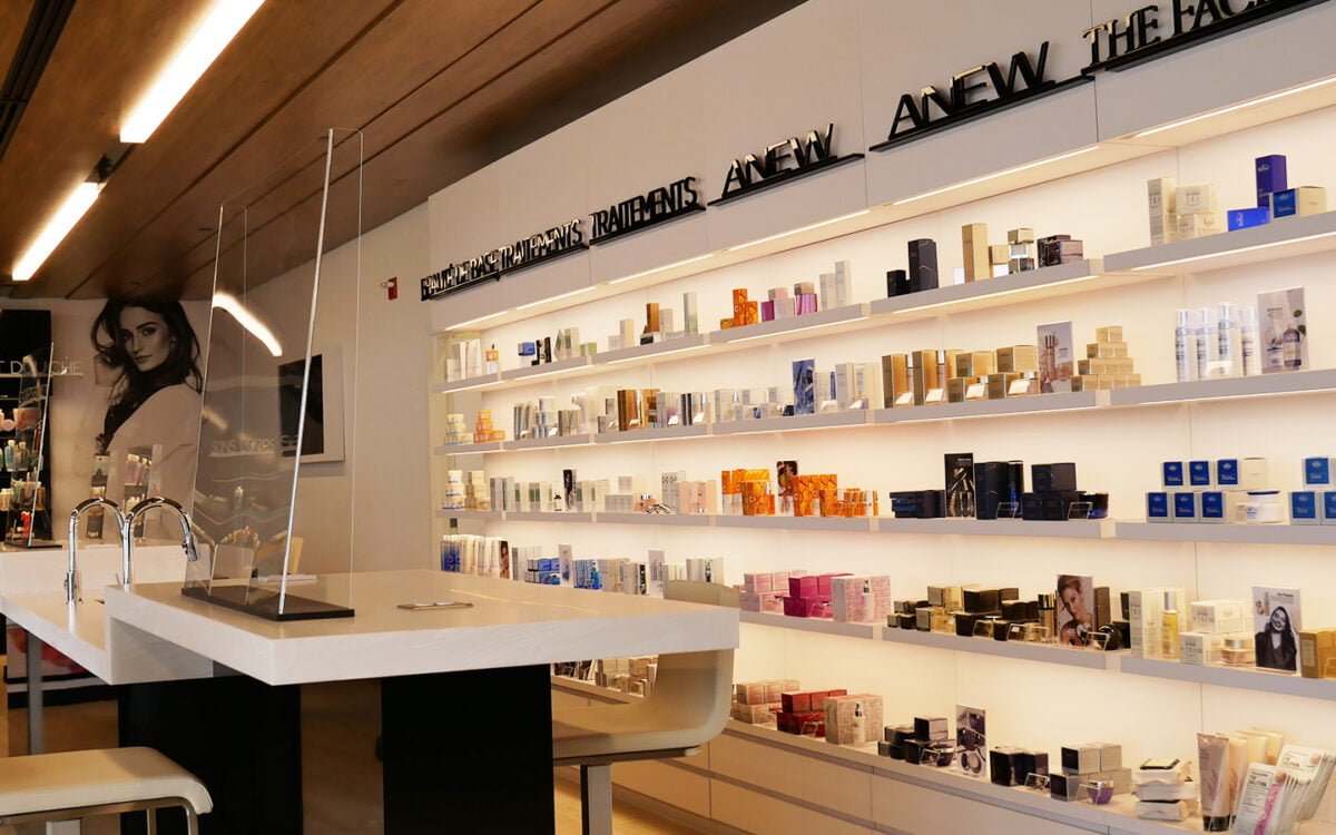 INTERIOR OF AVON STUDIO WITH SHELVES SHOWCASING A RANGE OF PRODUCTS. PHOTO: AVON