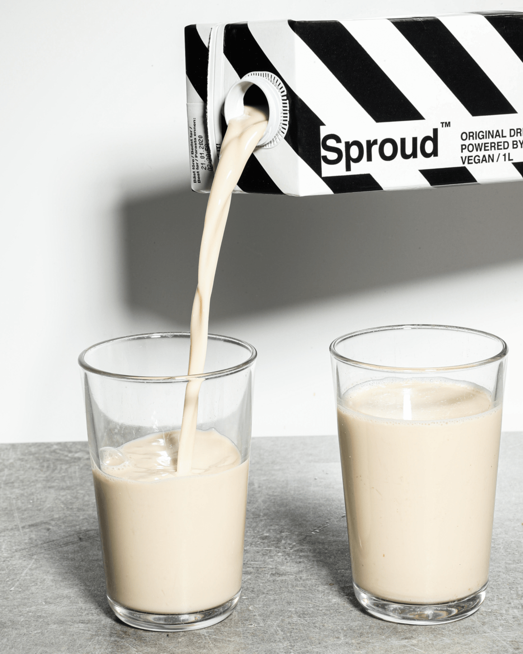 Plant-based Sproud milk being poured into glasses. Photo: Sproud